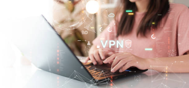 istock VPN (Virtual Private Network). Cyber security technology concept. A woman is typing on a laptop. 2148588437