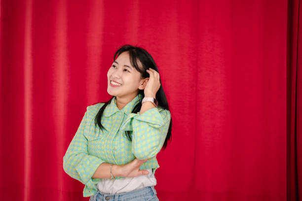 istock portrait asian woman  next to wall 2148589197