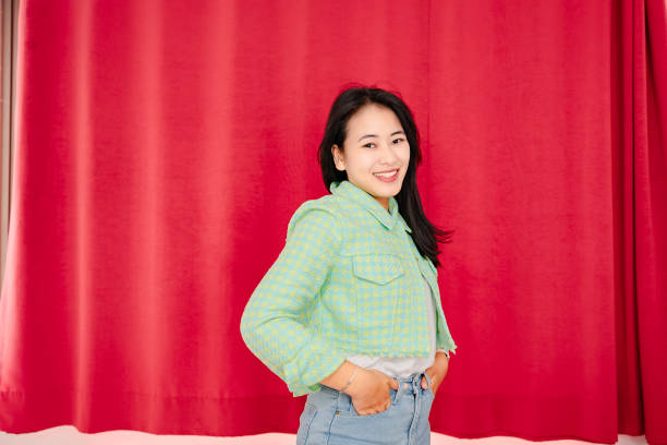 istock portrait asian woman  next to wall 2148589201