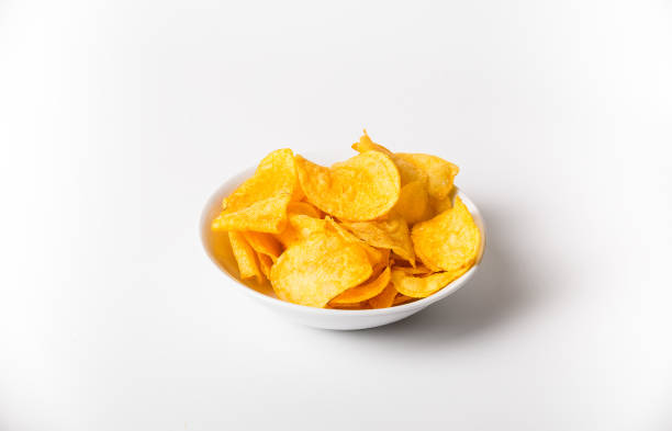 istock A bowl of chips is sitting on a white background 2148589318