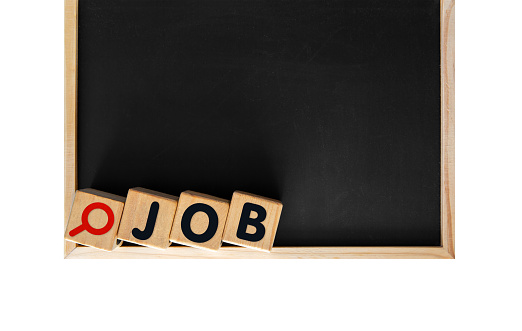 JOB word with magnifying Glass Icon on Toy blocks and blackboard isolated.