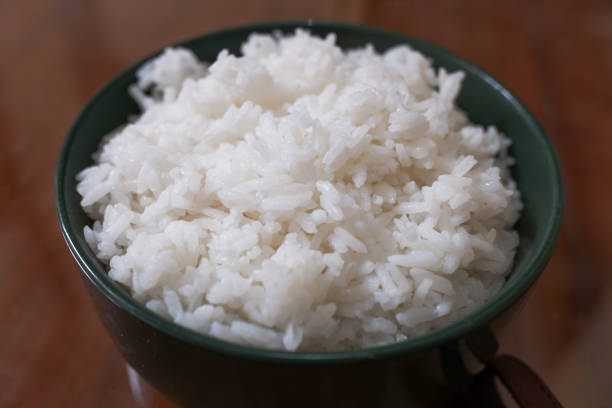 istock One bowl of white rice on a brown wooden table 2148590626