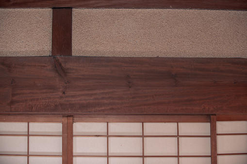 Thick beams of an old Japanese house built using traditional architectural methods