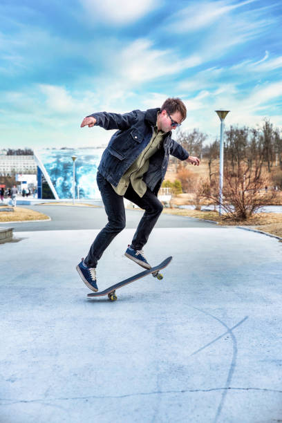 istock Young man riding a skateboard making tricks and jumps 2148591016