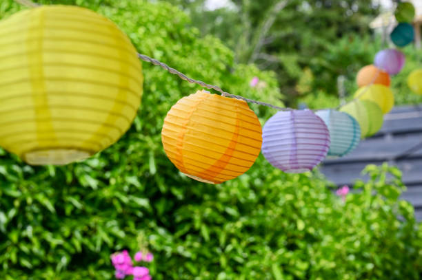 istock Summerly garden scene with colorful lampions. 2148591435