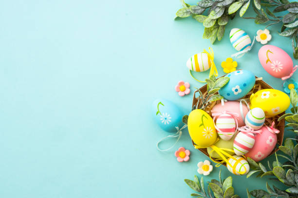 istock Easter eggs in the nest on blue background. Easter decor. Flat lay image with copy space. 2148592960