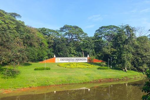 Depok, Indonesia - April 10, 2024: View of signboard of University of Indonesia and trees in background