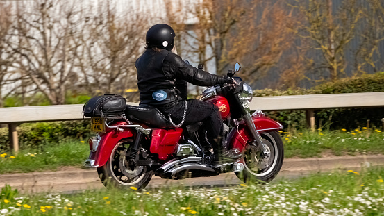 Milton Keynes,UK- Apr 14th 2024: 1993 Harley Davidson motorcycle  on a British road