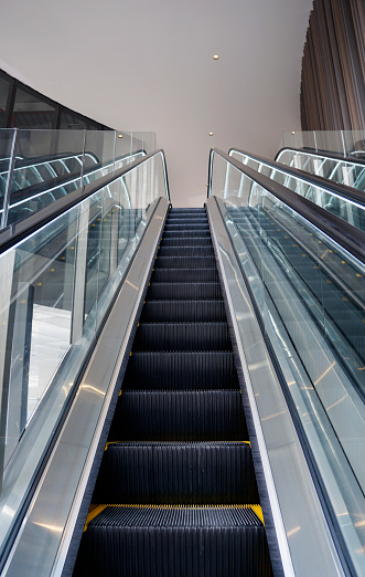 Concept photo of glass auto electric escalator with led lighting system