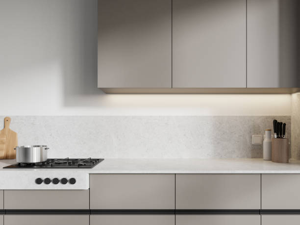 istock Minimalist home kitchen interior with kitchenware and stove, beige shelves 2148594988