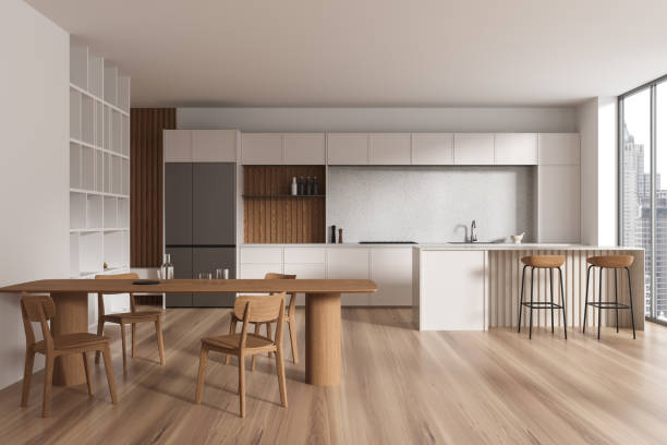 istock Beige home kitchen interior with eating and cooking space, panoramic window 2148595484