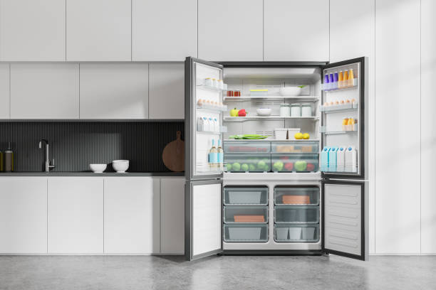 istock Stylish home kitchen interior with cooking cabinet and opened fridge with food 2148595708