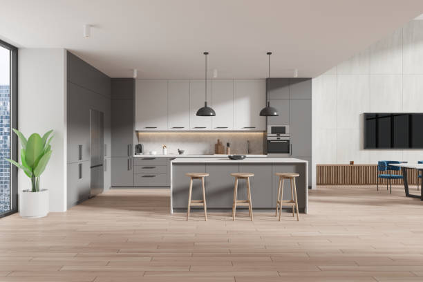 istock White and gray kitchen interior with table and island 2148595776