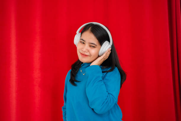 istock portrait asian women using headphone 2148595785