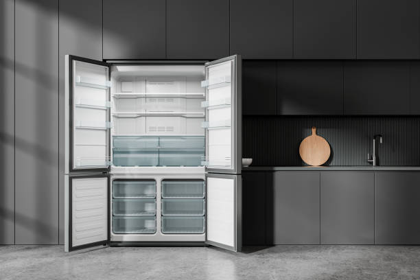 istock Dark home kitchen interior with cooking cabinet and empty opened fridge 2148596190