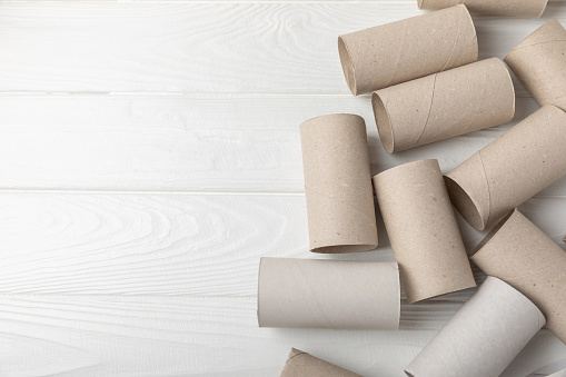 Empty toilet paper roll. Empty toilet paper rolls on  background. Paper tube of toilet paper. Place for text. Copy space. Flat lay. Eco-friendly reuse recycle