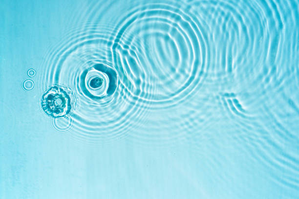 istock Circles and waves on blue water in sunlight 2148597810