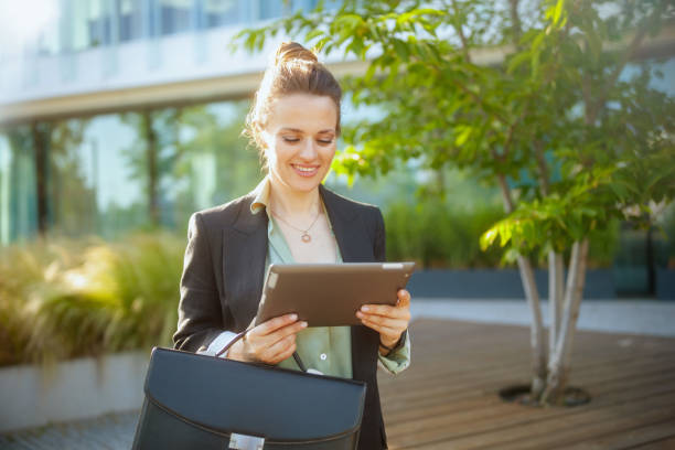 istock smiling modern woman worker in business district 2148597846