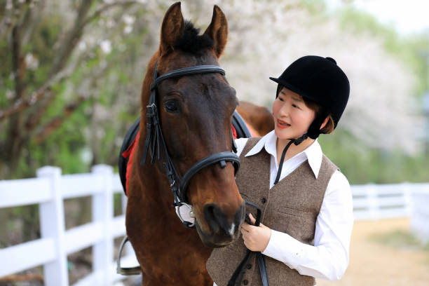 An Asian woman and a horse