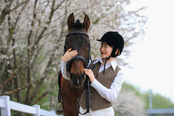 An Asian woman and a horse