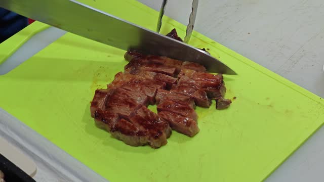 Cutting grilled steak