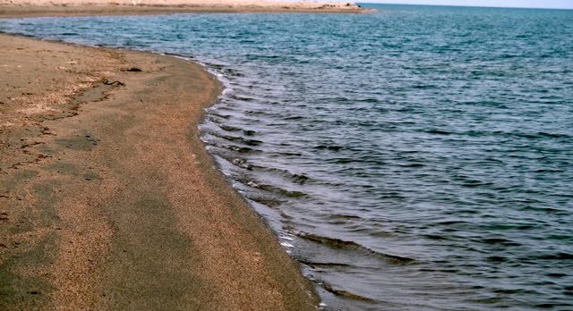 Shore of lake Issyk-Kul in cloudy weather