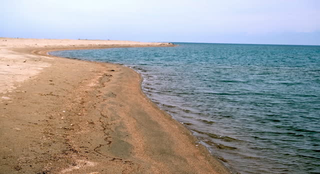 Shore of lake Issyk-Kul in cloudy weather