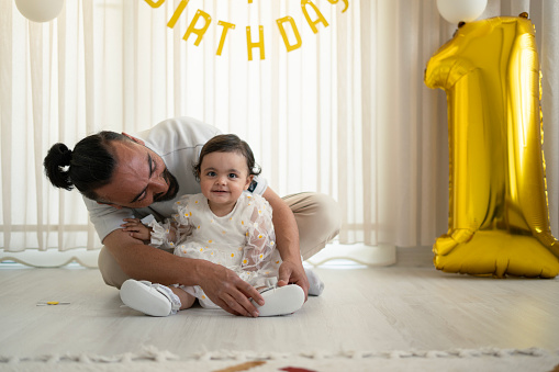 Sweet baby celebrates her first birthday with her daddy