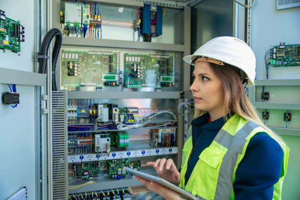istock Electricity engineer working in solar panels electrical substation, checking the condition of the power equipment. 2148602869