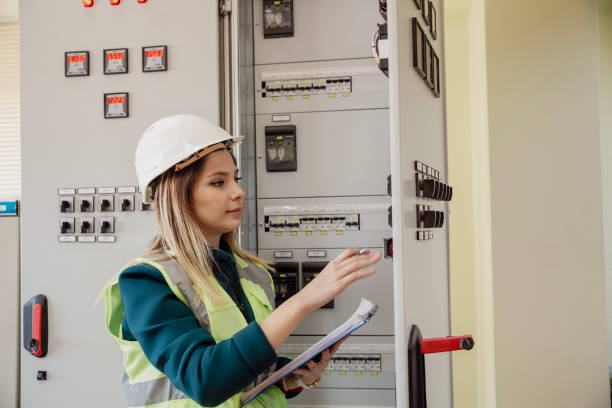 istock Electricity engineer working in solar panels electrical substation, checking the condition of the power equipment. 2148602870