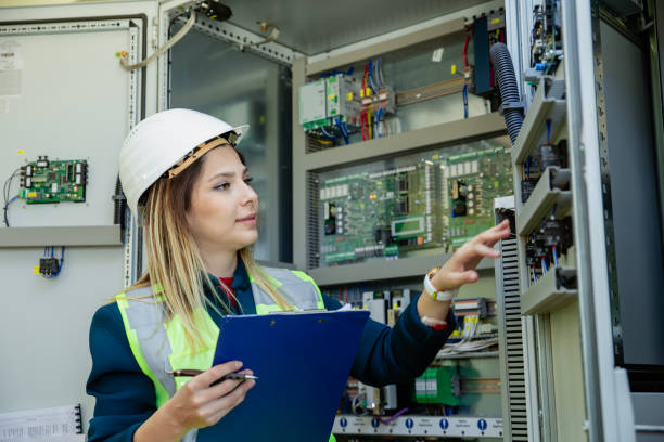 istock Electricity engineer working in solar panels electrical substation, checking the condition of the power equipment. 2148602872