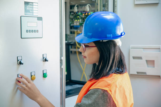 istock Young female maintenance engineer working at energy control room 2148602890