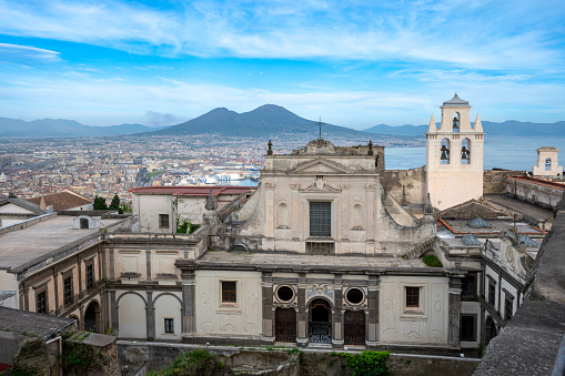 Naples, Campania, Italy - 9, April 2024: Overview from Castel Sant'Elmo, with the Certosa di San Martino in the foreground, Vesuvius in the background.