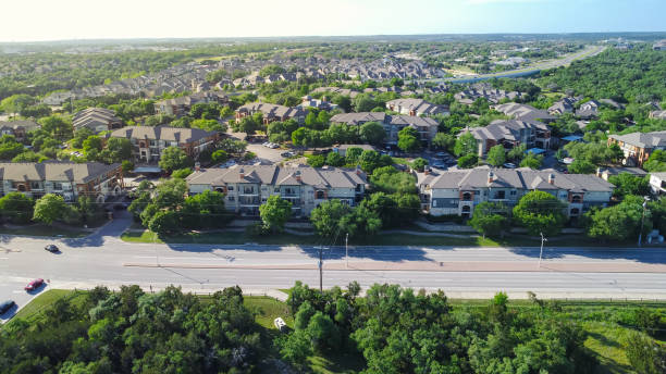 istock New apartment complex near Brushy Creek Road with E Whitestone Blvd background, Cedar Park, Austin, Texas, park side suburban rental buildings lush green trees to horizontal line, aerial view 2148603264