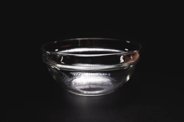 istock Empty glass plate or salad bowl for one person, on a black background, close-up 2148603869