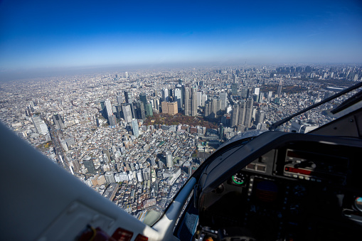 View from helicopter flying over Shinjuku high raised buildings