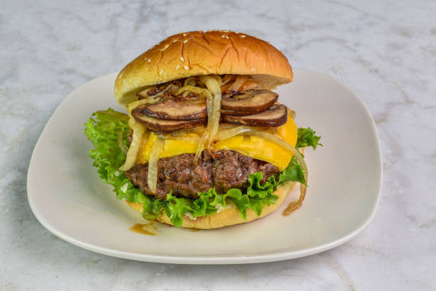 istock cheese burger with  mushrooms and onions 2148604984