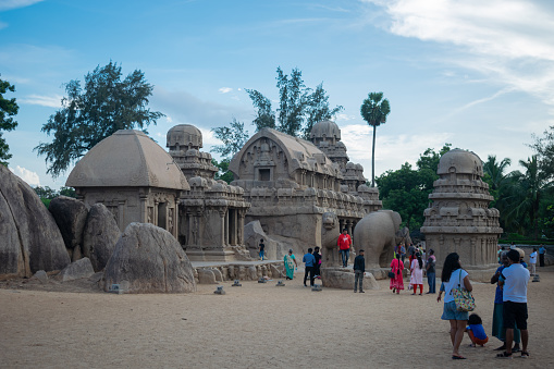 Mahabalipuram, India - 28 November 2023, Picture of five rathas along with tourists at UNESCO world heritage site of Mahabalipuram. Ajanta, Ellora, Hampi, ancient, stone, sculpture, carvings, sacred, pilgrims
