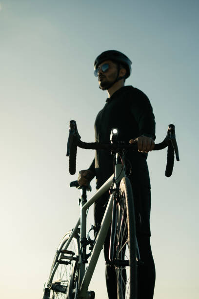 istock Close-up Professional cyclist watching the view at sunset 2148605795