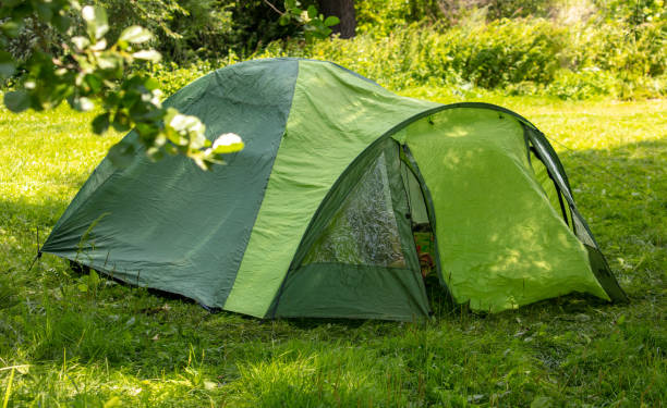 istock Tourist tent on green grass 2148606526