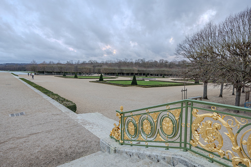 Chateau de Versailles, Versailles, France - December 28, 2023:  View from the step outside Grand Trianon of the Chateau de Versailles on a cloudy day.  HDR encoded.