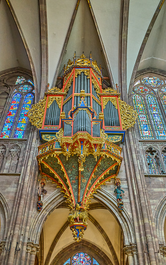 Strasbourg, France- September 22, 2022:  A organ in the nave of the gotic Cathedrak of Our Lady