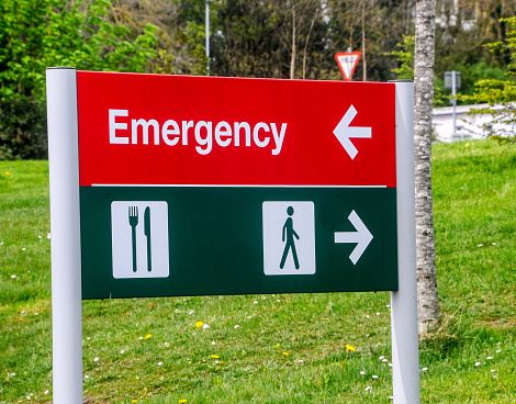 Royalty free stock photo of post sign indicating the entrance of the main hospital