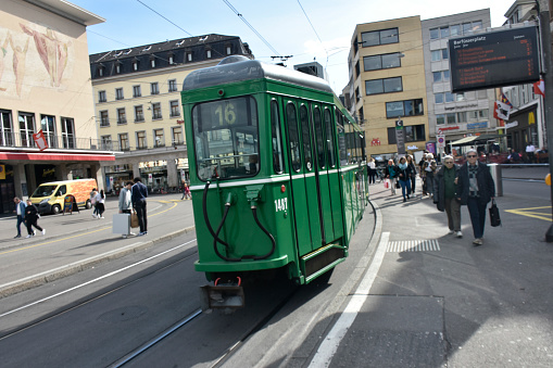 Basel, Switzerland - March 21, 2024: Basel City Public Transportation Tram, Land Vehicle, People Walking, Shopping, Waiting For Tram Scene And More