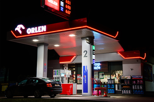 Orlen gas station for refueling car and cafe at night. Katy Wroclawskie, Poland - February 9, 2024