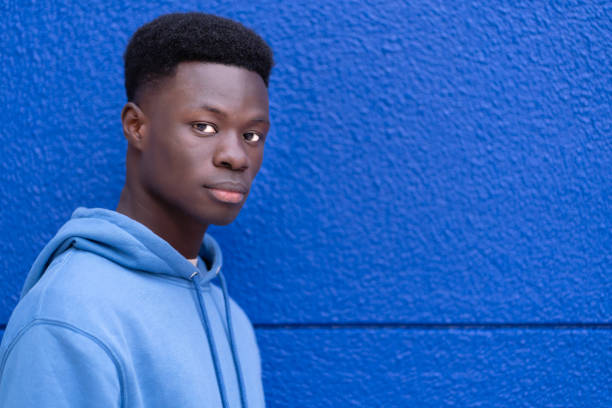 istock Man Standing in Front of Blue Wall 2148615076