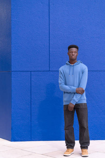 istock Man Standing in Front of Blue Wall 2148615107