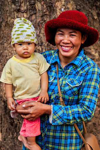 Cambodian mother holding her baby in village near Siem Reap, Cambodia