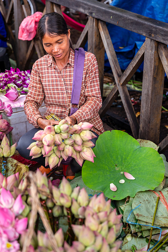 Cambodian women selling flowers on a local market in Siem Reap, Cambodia