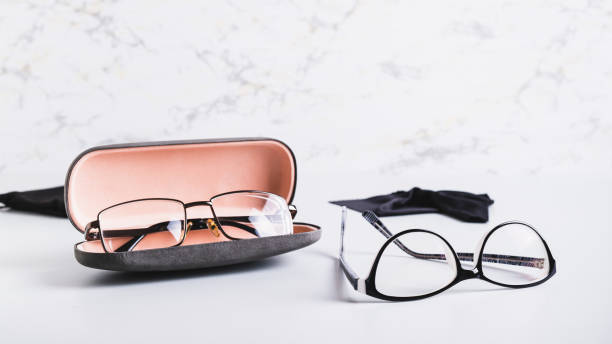 istock Eyeglasses in an open hard case and eyeglasses on a table 2148617289
